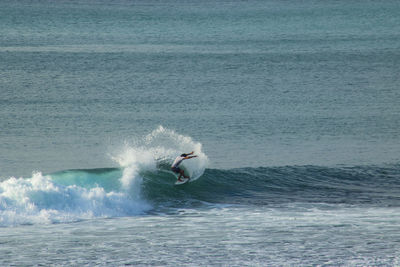 High angle view of man surfing in sea