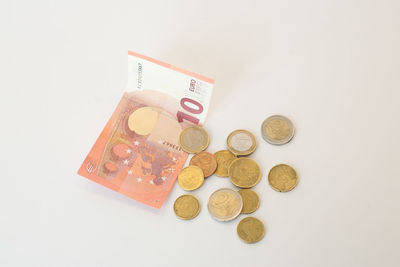 Close-up of coins on white background