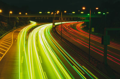 High angle view of light trails on road at night