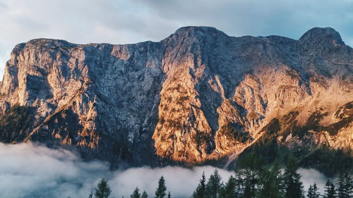 Scenic view of mountain against cloudy sky