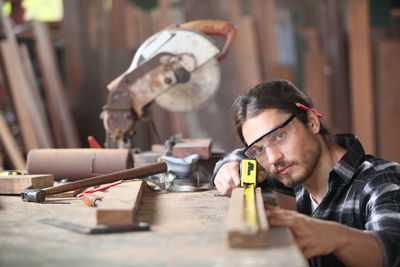 Portrait of man working on table