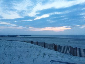 Scenic view of sea against sky during winter