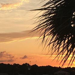 Low angle view of built structure against sky at sunset