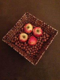 High angle view of apples in basket on table