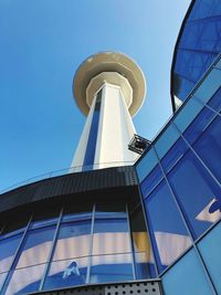 Low angle view of modern building against blue sky