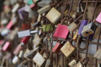 Close-up of padlocks hanging on railing