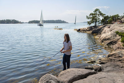 Teenager fishing at lake