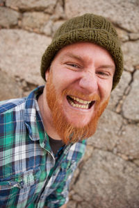 Portrait of smiling man wearing hat