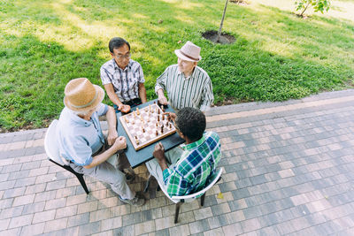 High angle view of people sitting in park