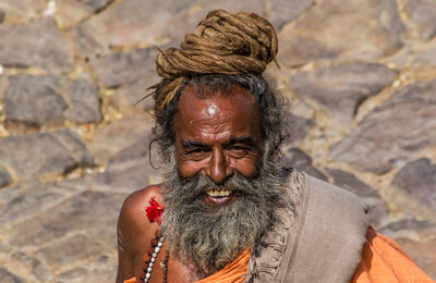 Portrait of smiling young man outdoors