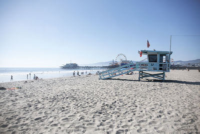 Scenic view of beach against clear sky