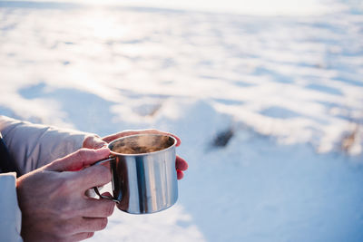 Man holding coffee cup