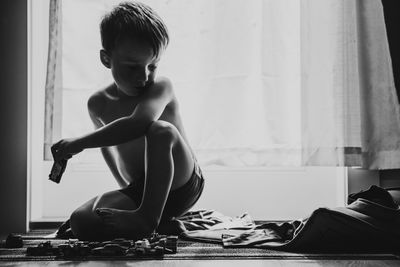 Man looking at camera while sitting at home
