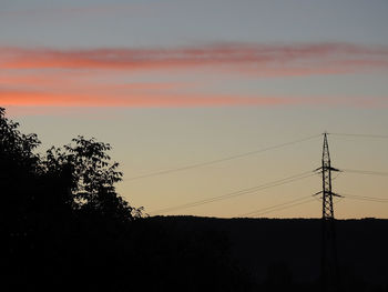 Low angle view of silhouette trees against sky during sunset