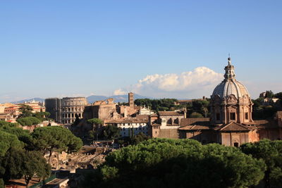 Buildings against blue sky and clouds