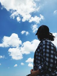 Rear view of man standing against sky