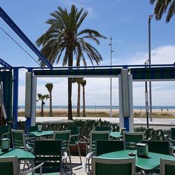 Chairs and tables at seaside