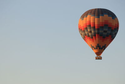 Low angle view of hot air balloon against clear sky