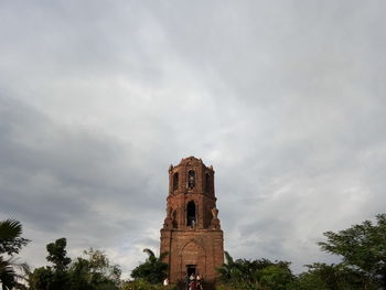 Low angle view of historical building against cloudy sky