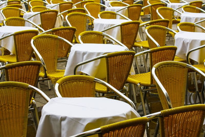 Empty chairs and tables in restaurant