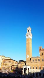 Low angle view of historical building against blue sky