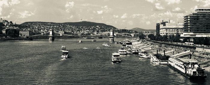 High angle view of river and cityscape against sky