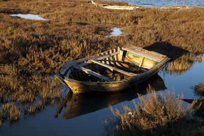 High angle view of abandoned boat moored at lake