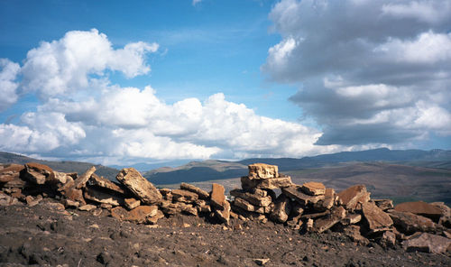 Scenic view of landscape against cloudy sky