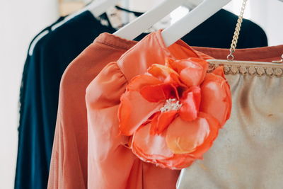 Female cloths and accessories hanging on a rack