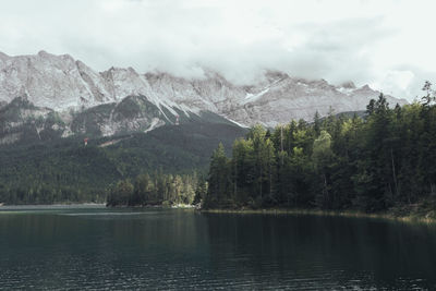 Scenic view of lake with mountains in background