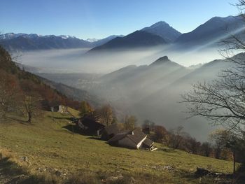 Scenic view of mountains against sky on sunny day