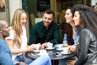 Group of people sitting in cafe