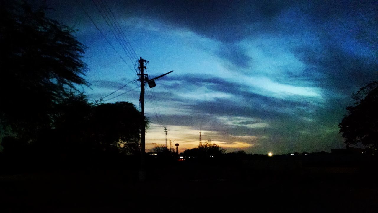 silhouette, sky, tree, sunset, cloud - sky, electricity pylon, dusk, power line, electricity, low angle view, tranquility, dark, cloud, nature, fuel and power generation, cloudy, tranquil scene, beauty in nature, scenics, landscape