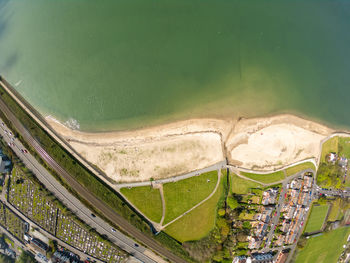 High angle view of road amidst green land