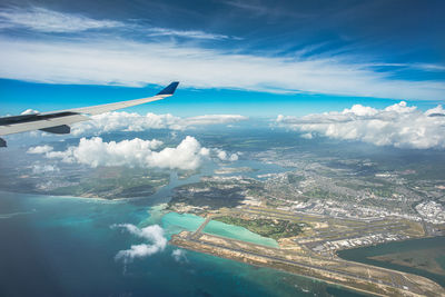 Aerial view of cityscape against sky