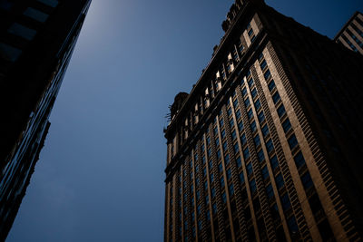 Low angle view of skyscraper against clear sky