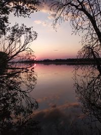 Scenic view of lake against romantic sky at sunset