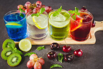 High angle view of various fruits and drinks on table