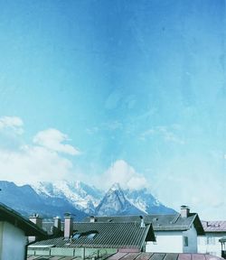 Scenic view of snow covered mountains against sky