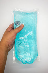 Close-up of hand holding ice cream