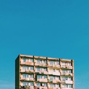 Low angle view of building against clear blue sky