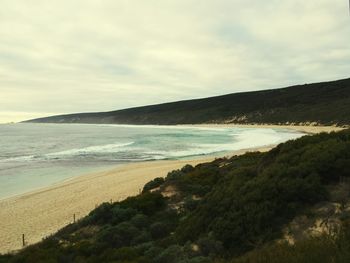 Scenic view of sea against cloudy sky