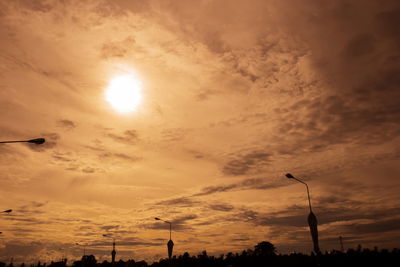 Low angle view of street light against sky during sunset