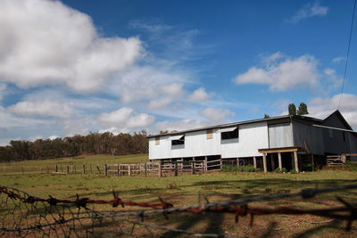 House on field against sky