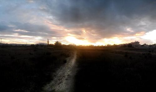 Scenic view of field against sky during sunset