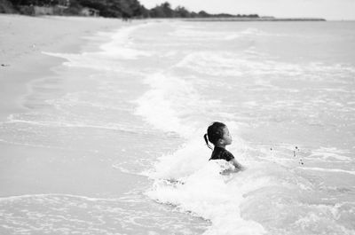 Man swimming in sea