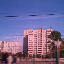 Buildings in city against sky