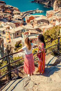 Rear view of woman looking at buildings