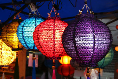 Low angle view of illuminated lanterns hanging