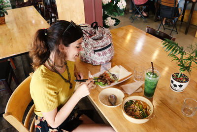 High angle view of woman sitting in restaurant